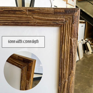 A1 Poster Frame in a Rustic Light Timber Finish made from quality custom framing materials.