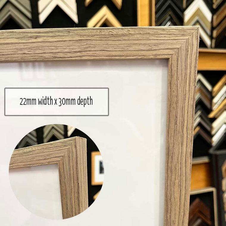 A3 Photo Frame in a Timber Look finish made from quality custom framing materials. This frame is a one off made from excess stock and includes quality foamboard, Perspex, and Wire Pack for both vertical and horizontal hanging on the wall. This frame is suited to an A3 (42cm x 29.7cm) Photo or artwork, or you can add a matboard insert to fit a smaller A4 or 8"x10" Photo or Artwork